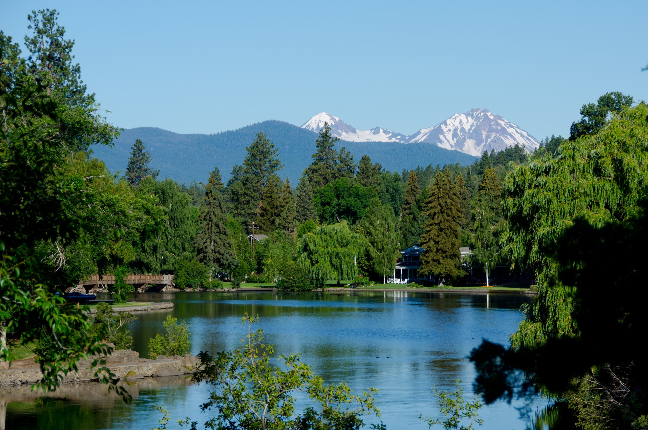 Mirror Pond reflecting downtown Bend, Oregon on a clear day